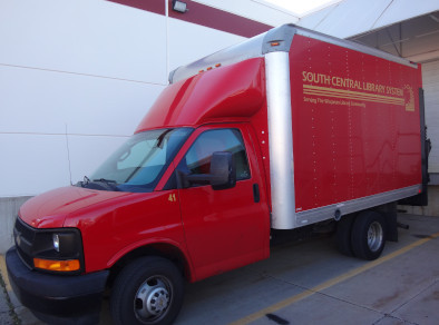 An SCLS Delivery red truck