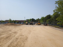 2023-05-25 - Dirt pile and construction equipment, bare ground scraped flat in the foreground